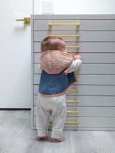 load image into gallery viewer, Baby climbing a white dresser with gold handles in a home setting wearing a quilted vest
